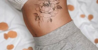 1 TOP 1 Tattoos Abdomen Outline of Black Flowers on the side below the ribs with leaves
