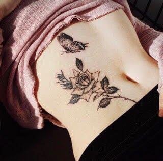 10 Tattoos Abdomen Rose with stem thorns and leaves plus black butterfly