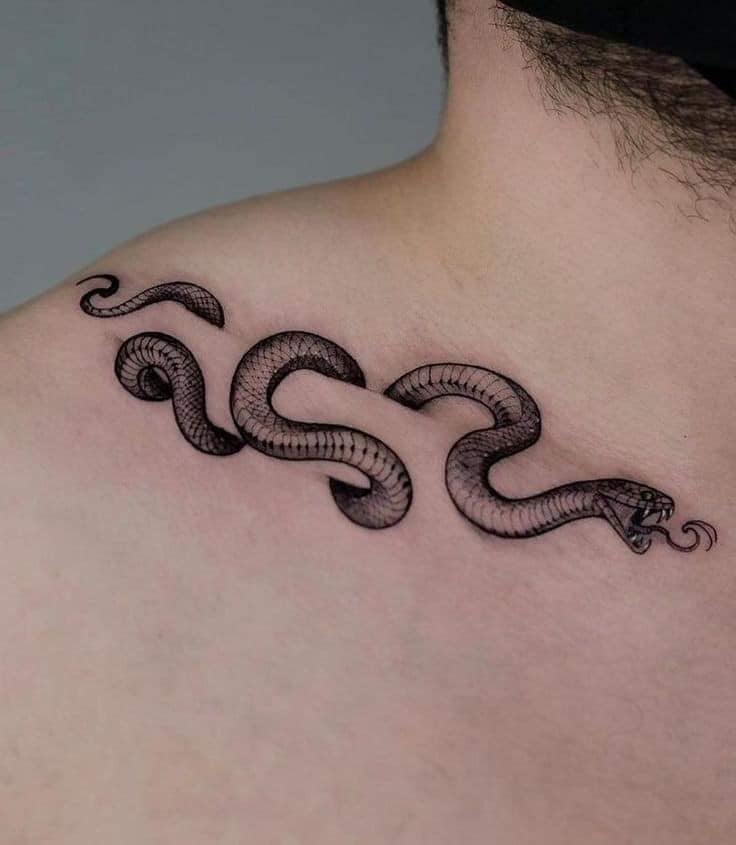 91 3D black snake or snake tattoo coiled in clavicle bone sticking out tongue